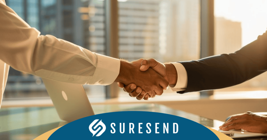 Alt: Professionals in business attire shake hands in office; SURESEND CRM logo featured as leading HubSpot alternative for resource center. Caption: Business professionals meeting in modern office with SureSend CRM logo, promoting a top HubSpot CRM alternative for teams. Description: Two professionals shaking hands in an office overlooking the city, laptop on the table, showcasing SureSend—a smart HubSpot CRM alternative—at the Sure Send CRM Resource Center.